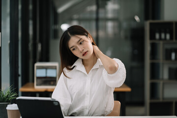 Fototapeta na wymiar Women sitting at home office workplace gesture neck pain office syndrome concept.