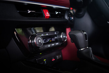 Fototapeta na wymiar Close up auto air conditioning adjustment button. Car air conditioning control unit with temperature status display. 