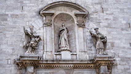 Fototapeta na wymiar Our Lady of Sorrows on the house facade in Bari, Italy