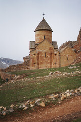 Fototapeta na wymiar Ancient armenian monastery in cloudy winter weather