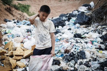 Poor children collect and sort waste for sale, concepts of poverty and the environment.