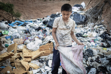Child labor. Children are forced to work on rubbish. Poor children collect garbage. Poverty, ...