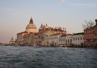 Fototapeta na wymiar Historical buildings of Venice in the rays of the setting sun