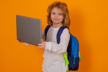 School children. School child using laptop. Kid boy from elementary school with pc. Little student, smart nerd pupil ready to study. Concept of education and learning.