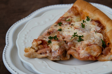 a slice of Meat lover Pizza on white background