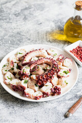 boiled chopped octopus on a concrete table