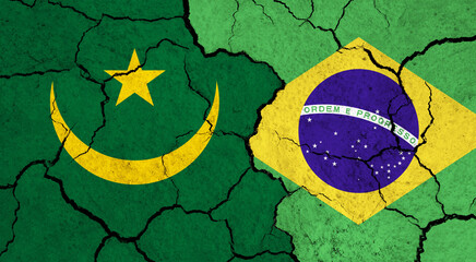 Fototapeta na wymiar Flags of Mauretania and Brazil on cracked surface - politics, relationship concept