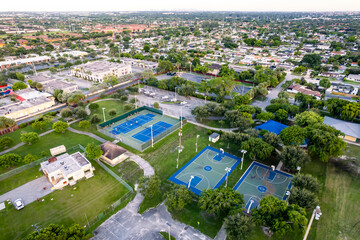 Aerial of tennis and basketball courts inside Norman and Jean Reach Park on Palm Springs North,...