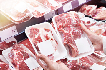 Hand with beef meat