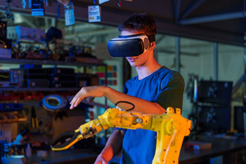 Teen remotely controlling robots in a laboratory