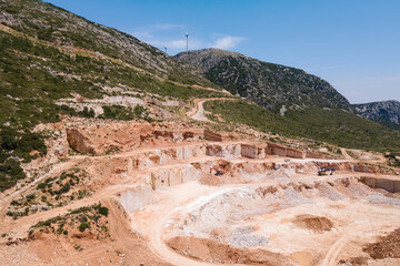 Aerial view of open mine marble quarry in mountain