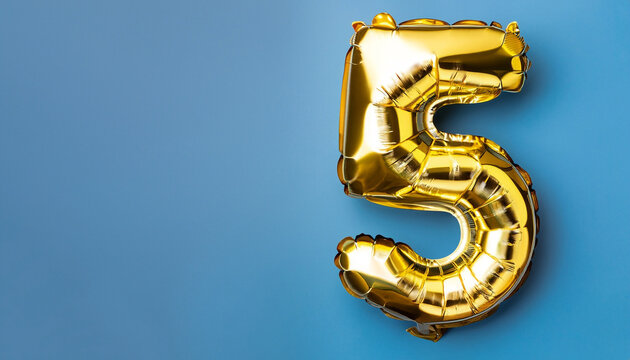 Banner with number 5 golden balloon with copy space. Five years anniversary celebration concept on a blue background.