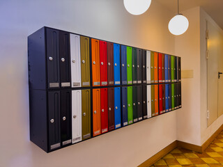 Group of colorful mail boxes in Spanish apartment's building