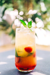 soft drink on the coffee shop flyer. refreshing sweet drink with ice on the cafe table. summer cold drink with fruits