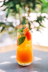 soft drink on the coffee shop flyer. refreshing sweet drink with ice on the cafe table. summer cold drink with fruits