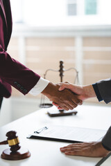 Portrait of lawyer in law office hand shake giving advice and advice on lawsuit consulting concept