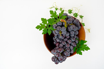 Purple grape Kyoho Grape with leaves on white background