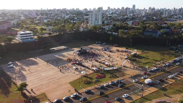 Aerial view of bustling festival event in the middle of city landscape in Posadas, Misiones, Argentina
