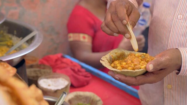 man making the papdi chaat recipe closeup view