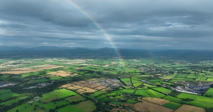 Excellent aerial footage of half of rainbow over a field in Kilkenny Ireland 