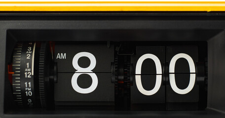 Flip clock White numbers on a black background star time 8.00 am.