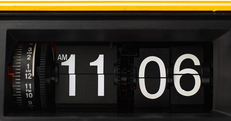 Flip clock displays the time at 11:06