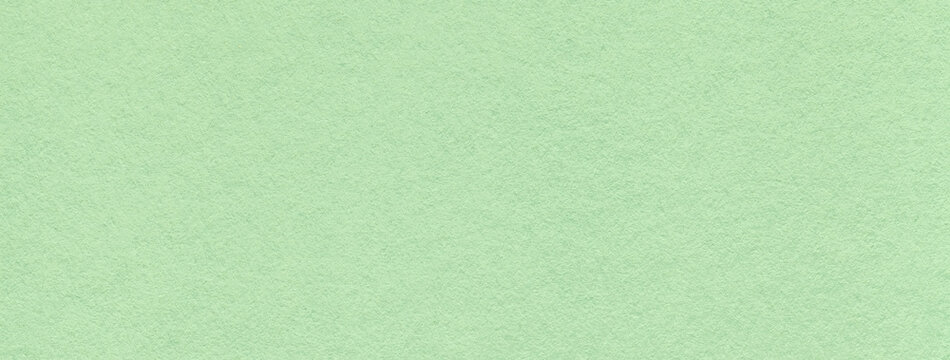Texture of craft light green and mint paper background colors, macro. Structure of vintage kraft olive cardboard.