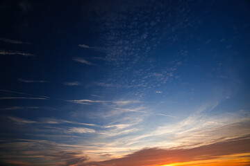 Naklejka na ściany i meble Beautiful clouds sky during summer sunrise. Amazing nature sunrise landscape photo.