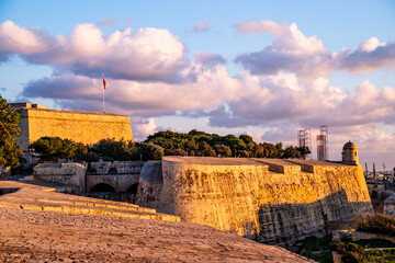 the old city wall of Valletta at sunset