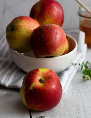honey with apples and honey. on a white table
