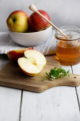honey with apples and honey. on a white table