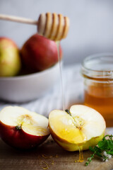 honey with apples and honey. on a white table