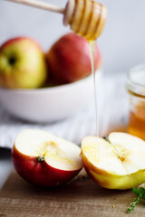 honey with apples and honey. on a white table