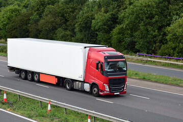 Lorry truck with large trailer on the road