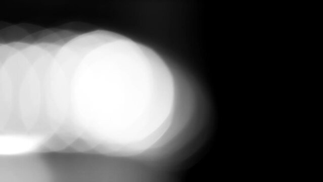 White blurry Bokeh effect on black background