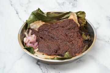 grilled sambal stingray with banana leaf