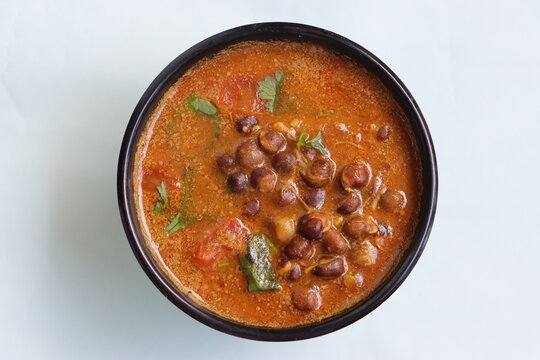 Kalya Vatanyachi Usal, kala vatana sambar or aamti, curry made with dried black peas in gravy with roasted coconut, onion and spice, Indian food