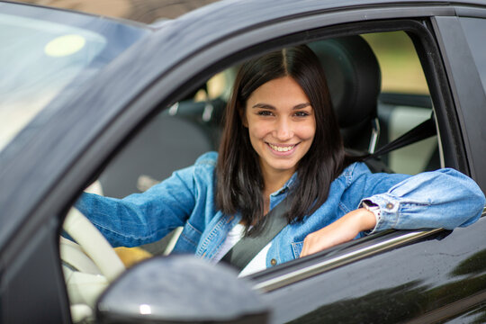 happy woman smiling in car