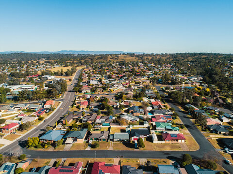Sunlit rows of houses on streets in town in Australia