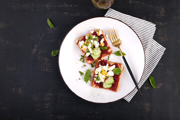 Healthy toast with pate beetroot, boiled eggs, basil and cucumbers. Delicious breakfast or snack....
