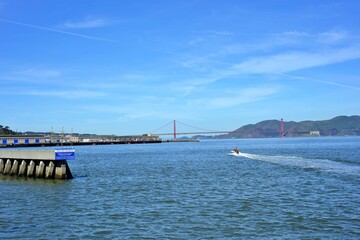 Pier39 San Francisco, California, USA - April 21, 2023. San Fransisco bay area with Golden gate bridge and Blue sky background.