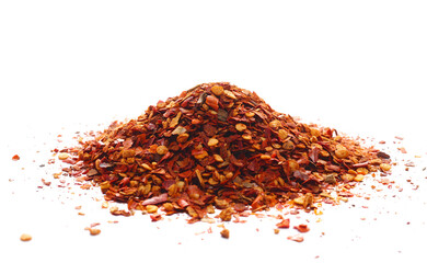 Pile crushed red pepper, dried chili flakes and seeds isolated on white 