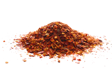 Pile crushed red pepper, dried chili flakes and seeds isolated on white 