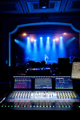 light / sound mixing desk at rock concert