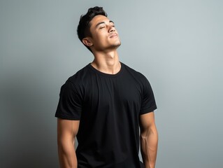 Obraz premium Photo shot of 30 years old asian man in emotional dynamic pose