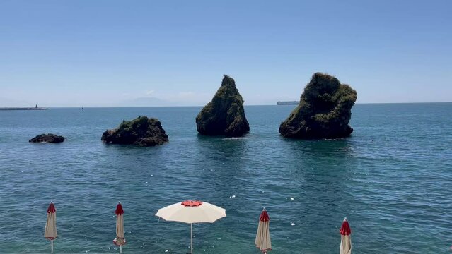 The Two Brothers, Symbol of Vietri sul Mare are the Two Brothers (Due Fratelli), two large rocks. Vietri sul Mare, Salerno, Italy. Vietri sul mare beautiful view of beaches with umbrellas, rocks 