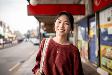 Young adult asian woman exploring the inner west urban streets of Sydney