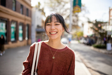 Young adult asian woman exploring the inner west urban streets of Sydney