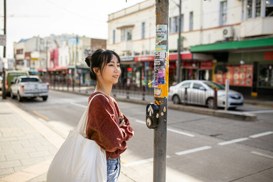 Young adult asian woman exploring the inner west urban streets of Sydney