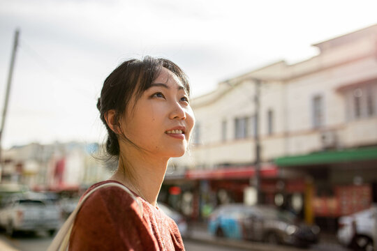 Young adult asian woman exploring the inner west urban streets of Sydney